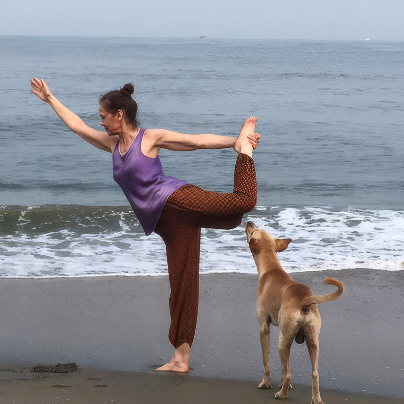 Audur in dancer pose by the sea