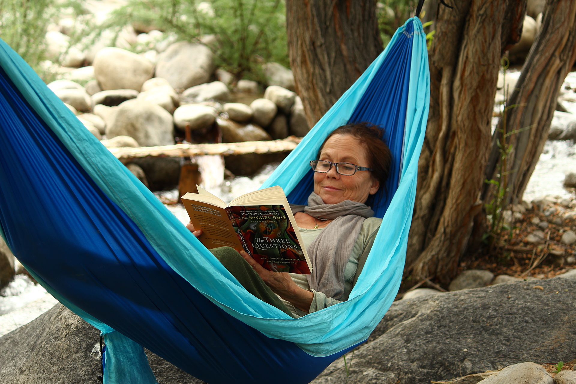 Audur reading in a hammock